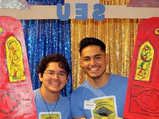 Students pose with a Red Doors frame at CAMP Enrichment Week. 